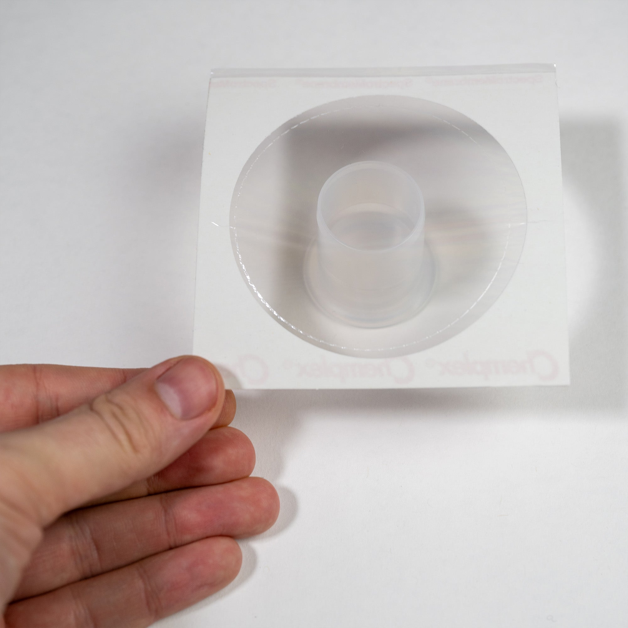 Hitachi LabX5000 Disposable Sample Cup Part Number 10003449 showing film on bottom part of cup