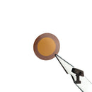 SciAps X-550 Turnings window Kapton shown held by a tweezer