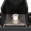 The SciAps X-Series Handheld XRF Benchtop Test Stand showing the sample chamber and a sample cup